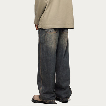 “RUSTED” JEANS