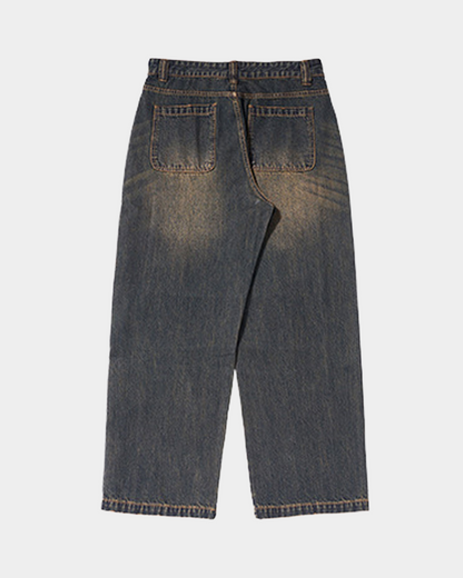 “RUSTED” JEANS